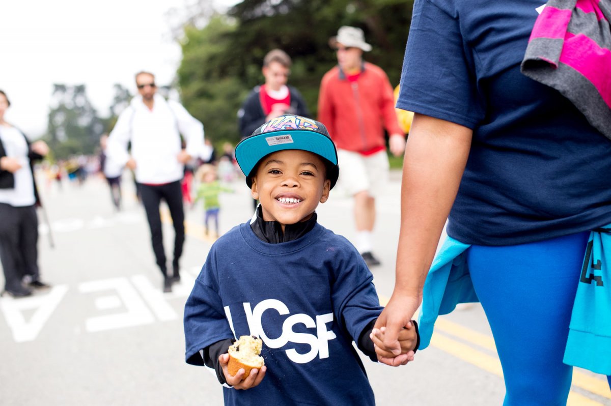 Four-year-old Korey Woods walks the 10K course with his family.