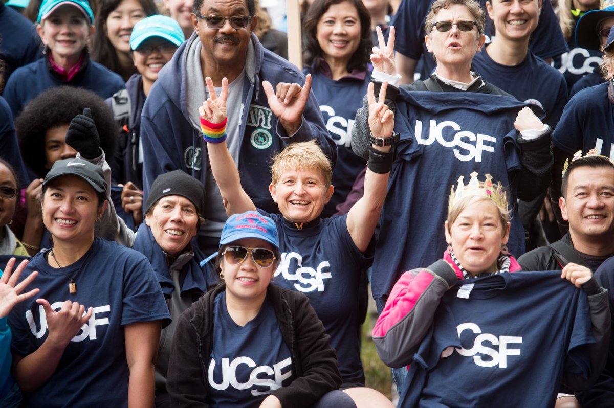 Faculty, staff and students show their UCSF pride during a group photo before the AIDS Walk began.