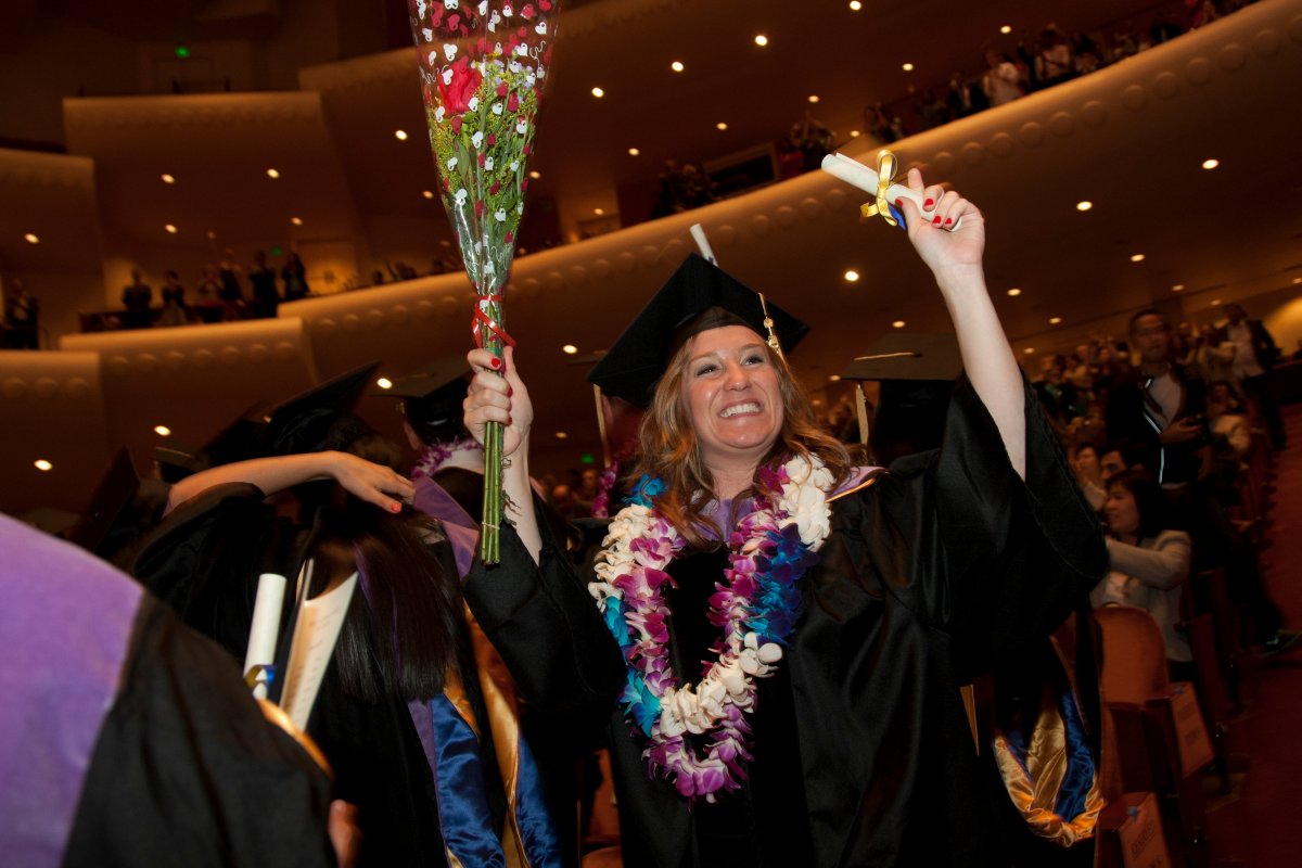 Graduates cheer after receiving their degrees from the School of Dentistry, which strives to be a worldwide leader in dental education and public health, clinical practice and scientific discovery.