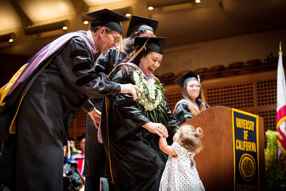 School of Dentistry graduate Antonia Moa celebrates during the commencement ceremony.