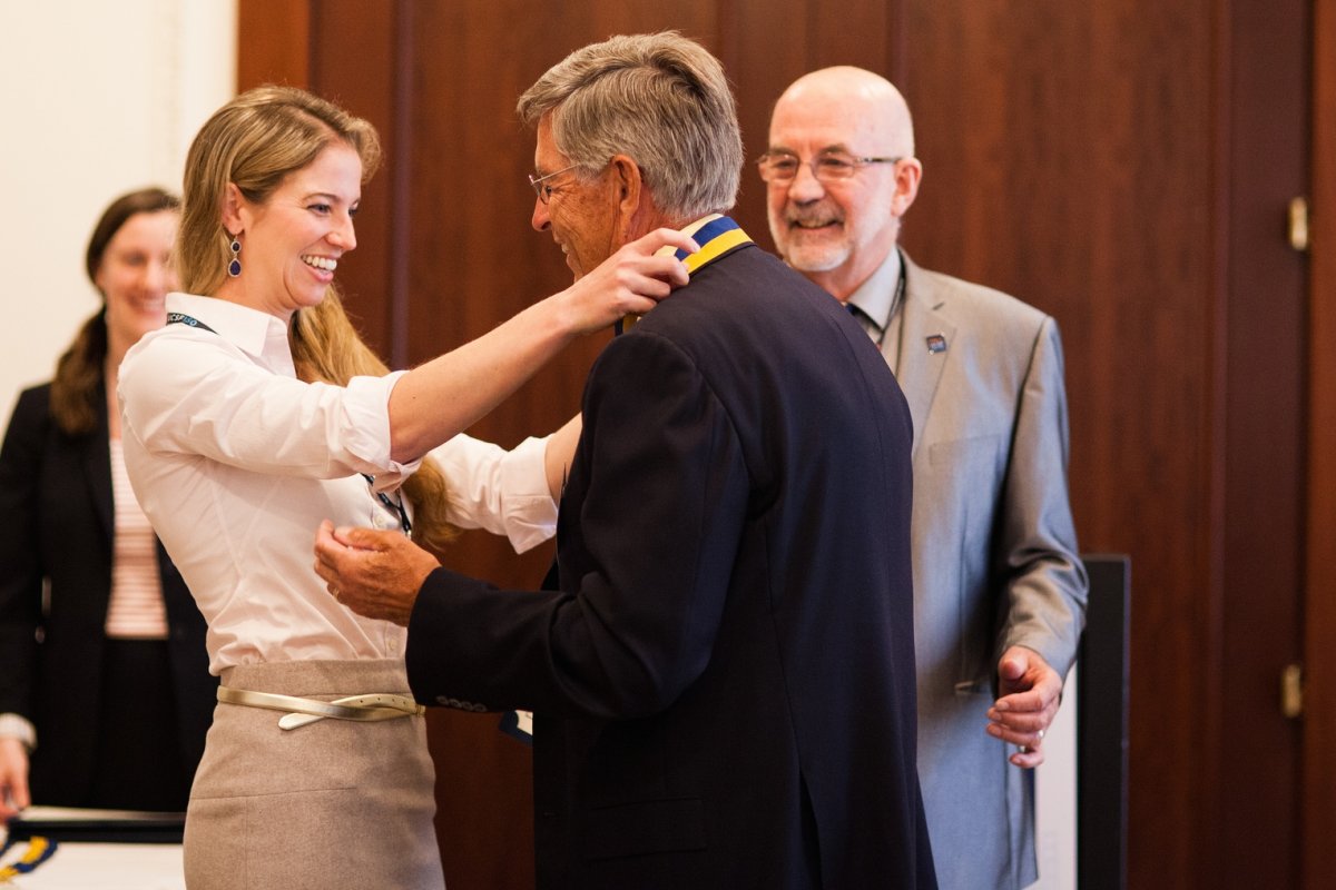 School of Dentistry Dean John Featherstone, PhD, (right) and fourth-year dentistry student Natalie La Rochelle welcome Leonard V. Cheney, DDS (Dentistry '64), into the Half Century Club at the Dentistry reception during Alumni Weekend 2014.