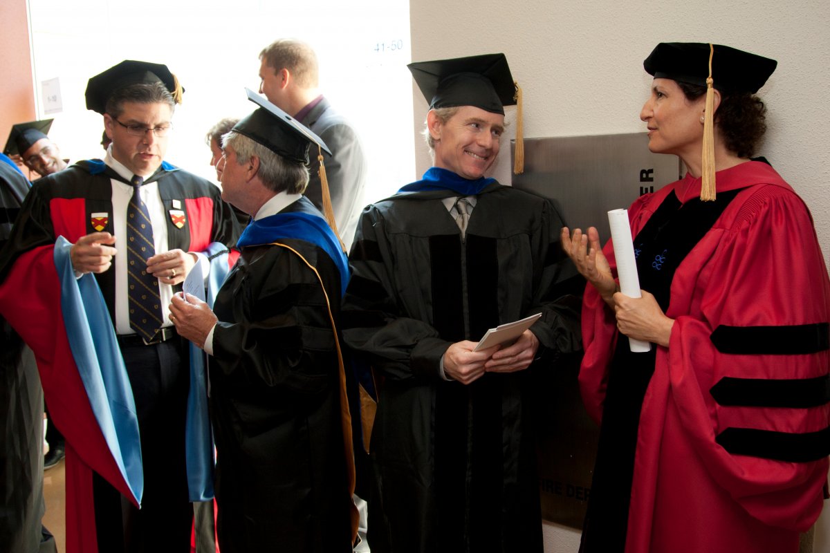 From left, Joseph Castro, vice chancellor of Student Academic Affairs, Executive Vice Chancellor and Provost Jeffrey Bluestone, commencement speaker Joseph DeRisi and Elizabeth Watkins, dean of the Graduate Division, talk prior to the commencment ceremony.