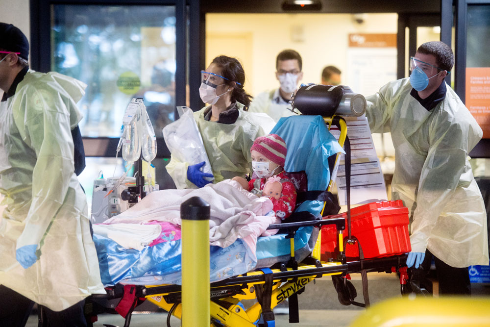 Five-year-old Anniston Klemme leaves Long Hospital at Parnassus with a full medical team by her side.