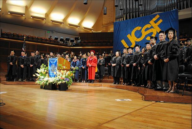 Faculty gather on the stage of Davies Symphony Hall at the beginning of commencement ceremony on May 24. 