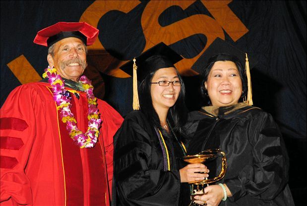 Pan Pan Wong, winner of the Bowl of Hygeia award, poses with Dean Guglielmo and Wilma Wong, president of the UCSF School of Pharmacy Alumni Association.