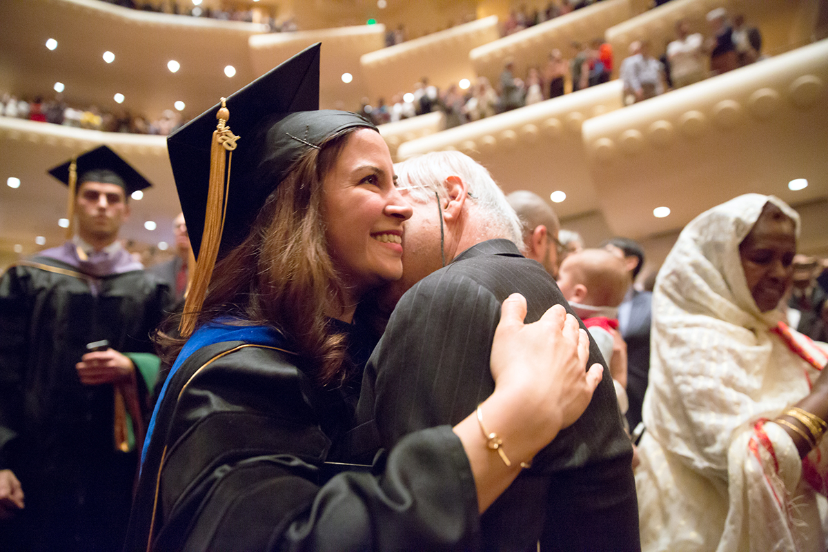 School of Medicine graduate Hengameh Zahed receives a hug during the commencement ceremony.