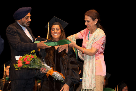 Family members participate in the joy of recognizing a major milestone in life: graduating from medical school.