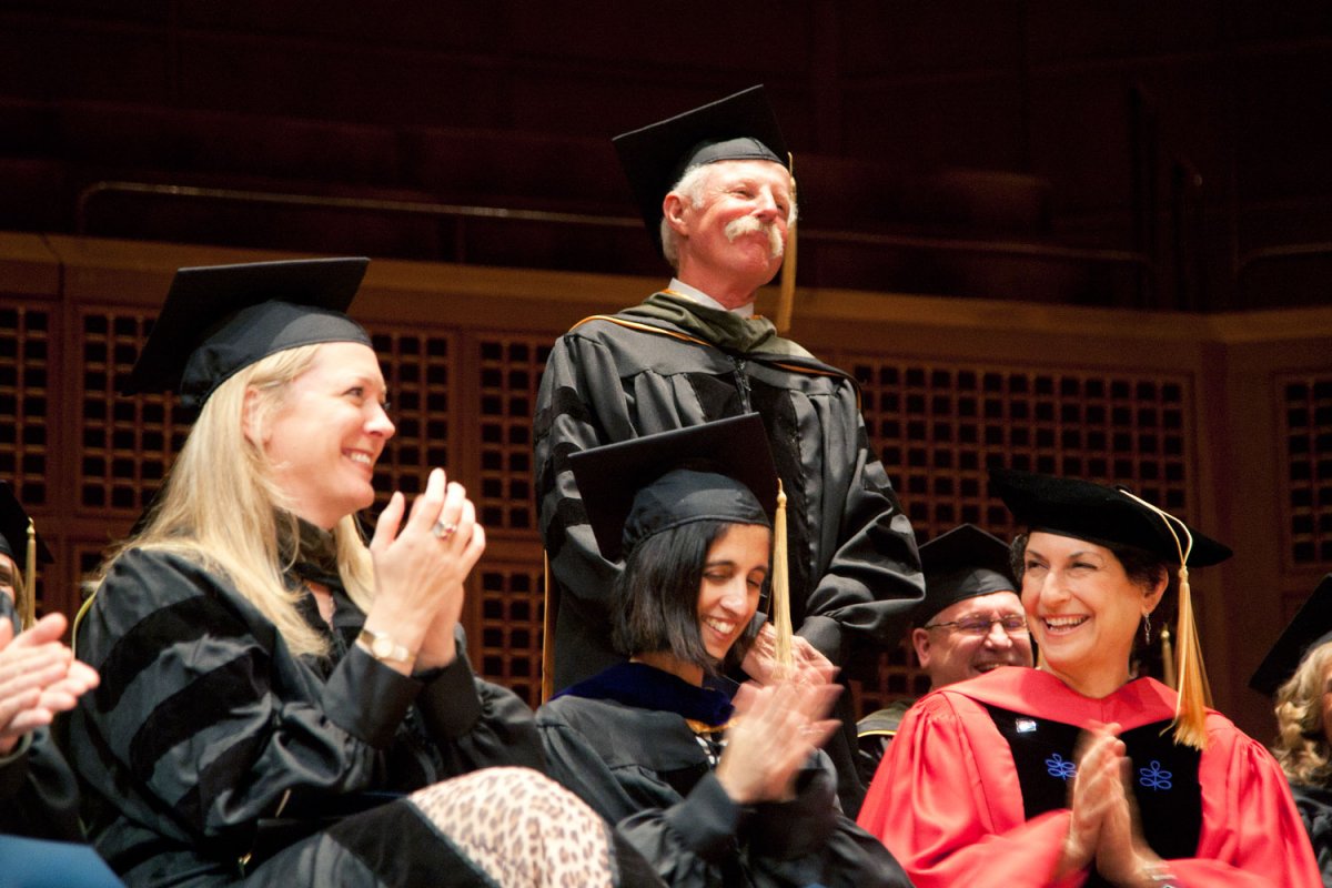 School of Pharmacy professor Steven Kayser, PharmD, gets a round of applause from department chairs Lisa Kroon and Tejal Desai and Graduate Division Dean Elizabeth Watkins.
