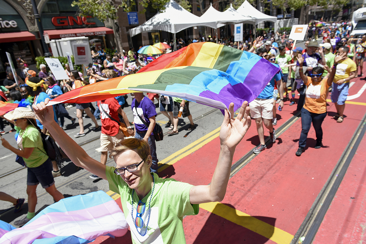 UC San Francisco's contingent in the San Francisco Pride Parade walks along Market Street.