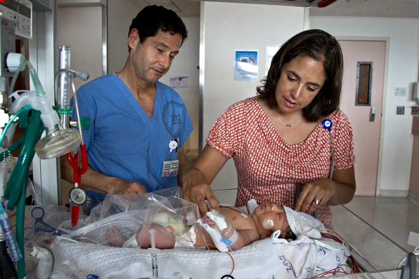 David Rowitch, MD, PhD, professor and chief of neonatology at the UCSF Benioff Children’s Hospital, and Sonia Bonifacio, MD, assistant adjunct professor in neonatology, consult on a newborn