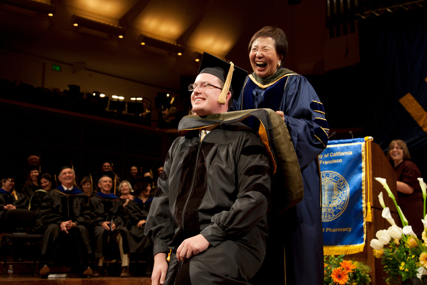 Mary Anne Koda-Kimble, PharmD, dean of the UCSF School of Pharmacy, participates in the last hooding of graduates