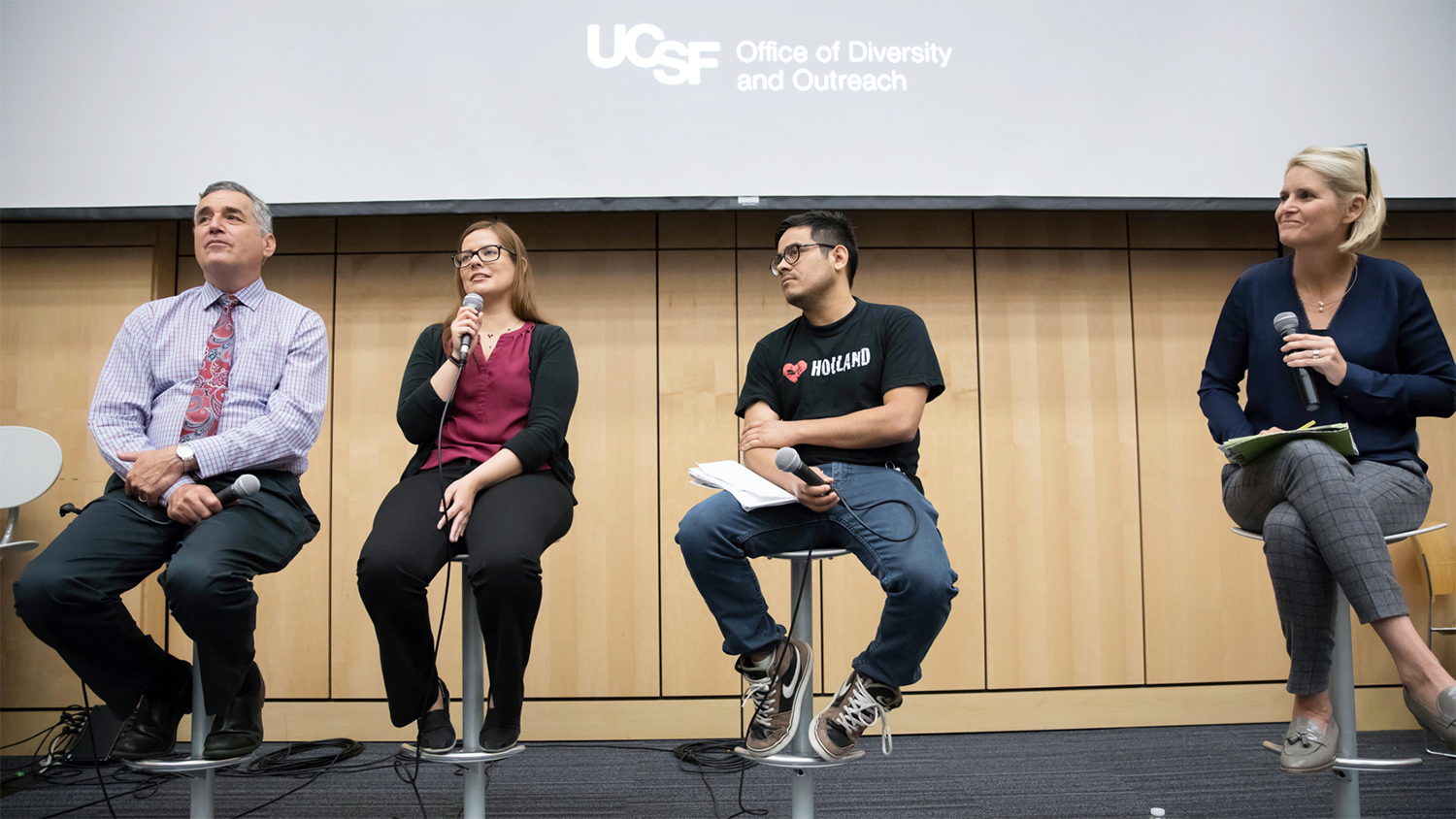David Wofsy, Ana Cruz, Walter Mancia and Amber Fitzsimmons talk during the Defending DACA forum in Cole Hall at UCSF’s Parnassus campus