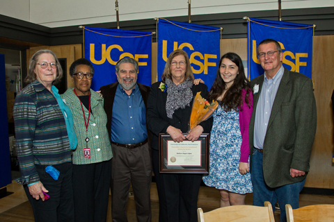 Barbara Bagot-Lopez, director of Community Relations for Strategic Communications and University Relations, stands with her daughter, Adela, and brother, Buck Bagot, both at right, and members of the Community Advisory Group, Corinne Woods, Dorris Vincent and Dennis Antenore after receiving the Chancellor's Award for Exceptional University Service