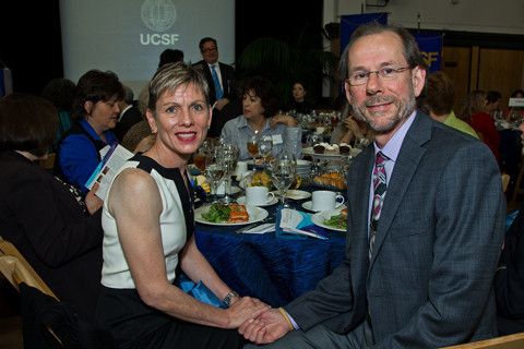 Susan Peloquin, RN, MS, CNIV, clinical nurse coordinator in the neonatal intensive care nursery at UCSF Benioff Children's Hospital, celebrated receiving the Distinguished Nurse Award with her colleagues and husband
