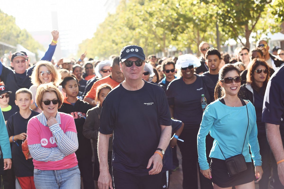 UCSF Chancellor Sam Hawgood, MBBS, leads the pack for the Hard Hat Walk, joined by Olympic champion figure skater Kristi Yamaguchi (right).