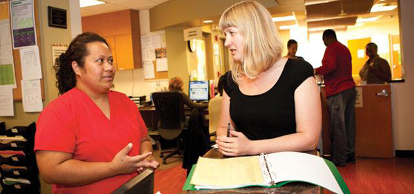 UCSF student Adrienne Franzese meets with medical assistant Sosefina Tagalu