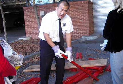 Firefighter Ed Chu teaches how to extricate a trapped victim as part of the Neigborhood Emergency Response Team training program at Laurel Heights.