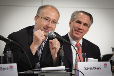 UCSF's Steven Deeks, MD, medical director of the Positive Health Program at San Francisco General Hospital and Trauma Center, speaks at the XIX International AIDS Conference (AIDS 2012) in Washington, D.C., while Robert Silician of John Hopkins University School of Medicine looks on.