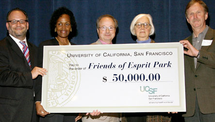 Bruce Spaulding presents a check to the Friends of Esprit Park