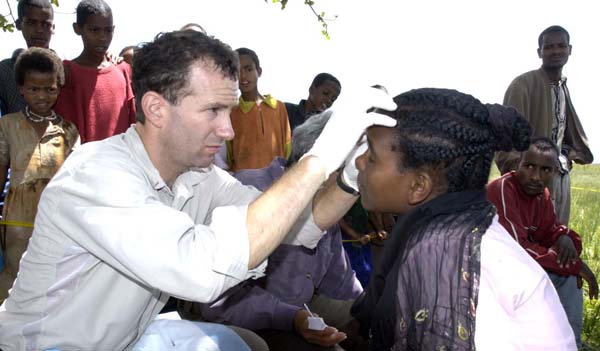 Bruce Gaynor, MD, performs an ocular examination on a patient in Ethiopia