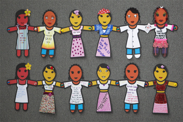 Art work hanging at the Global Village at the XIX International AIDS Conference. Showing paper dolls holding hands