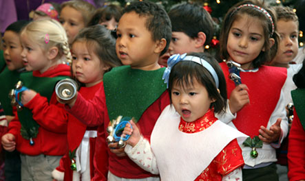 Children entertain the crowd with Christmas carols