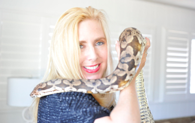 Taryn Hook poses with her pet snake, Larry