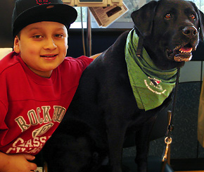 Roman Zabala with Kayla, an SPCA therapy dog.
