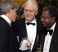 Hauser talks with honorees Haile Debas and Lloyd 
