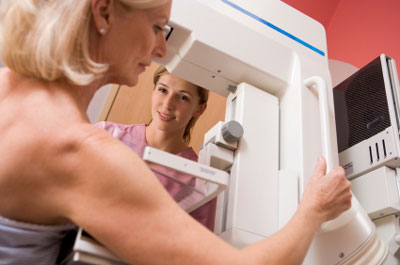 Stock image of women getting mammogram