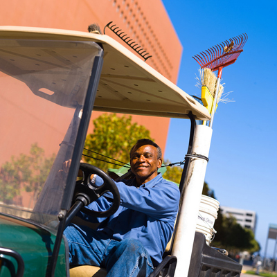 A gardener works to maintain the grounds at UCSF Mission Bay.