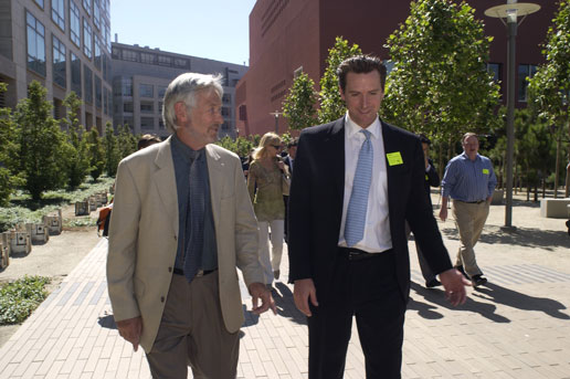 Gavin Newsom and Regis B Kelly walking on Mission Bay campus