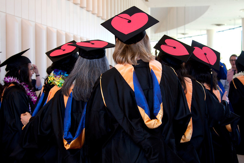 School of Nursing graduates show their decorated caps.