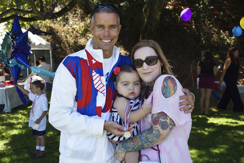 Former Olympic swimmer Dan Veatch poses with Scarlet Joaquim, a recent kidney transplant patient, and her mother, Alana Joaquim.