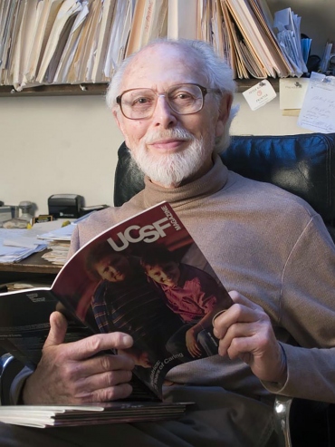 Henry Wachs holding an issue of UCSF Magazine