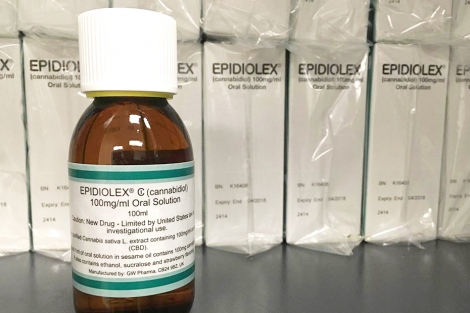 a bottle of Epidolex sits in front of boxes of the drug