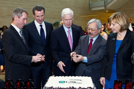 Ed Lee with local and UCSF leaders cutting a cake