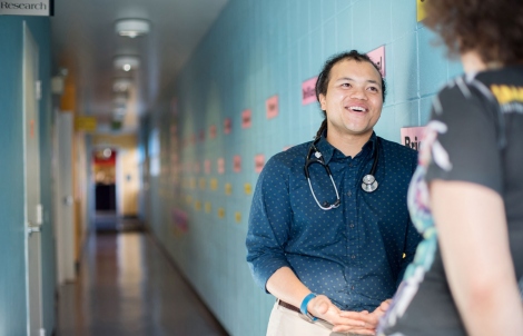 UCSF doctor talks in a hallway with a patient