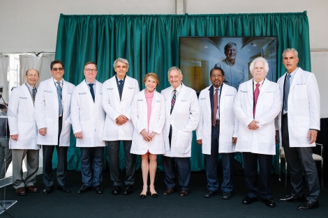UCSF Weill Institute for Neurosciences steering committee members Daniel Lowenstein, Matthew State, Sam Hawgood, Stephen Hauser,  Joan Weill, Sandy Weill, Talmadge King Jr., Stanley Prusiner, and Mitchel Berger stand on stage together