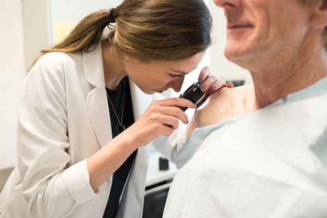 Dermatologist conducting a skin cancer screening
