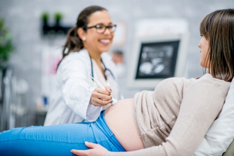 stock image of doctor doing an ultrasound on a pregnant woman