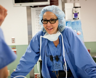 Nancy Ascher in surgical scrubs