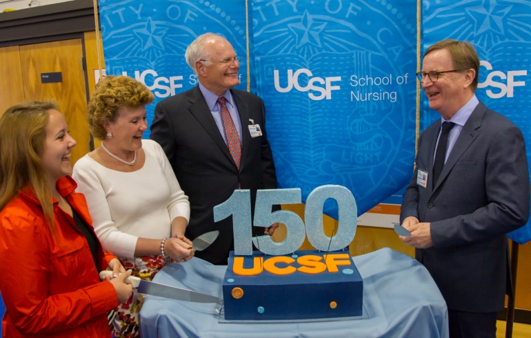 Rachel Vick, left, and Suzanne Carlisle Vick help UCSF Medical Center CEO Mark Laret, and UCSF Chancellor Sam Hawgood cut the UCSF 150th Anniversary cake at a celebration held at the Parnassus campus.