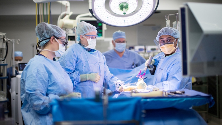 Praveen Mummaneni performs an awake spine surgery with Leslie Robinson, Catherine Miller, and Jeremy Lieberman.