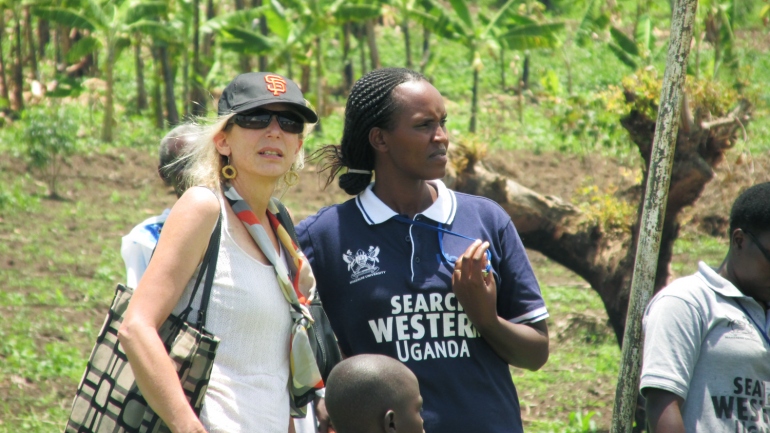 Diane Havlir, MD next to and Jane Kabami, MPH in Western Uganda.