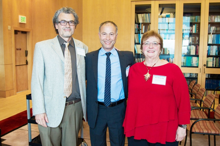 Winners of the 2015 Lifetime Achievement in Mentoring Award, Eliseo Pérez-Stable (left), MD, and Zena Werb (right), PhD, pose with Mitchell Feldman, MD, MPhil, director of the Faculty Mentoring Program, at a reception in the UCSF Library. 