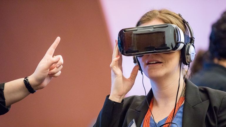 A woman wears a virtual-reality headset