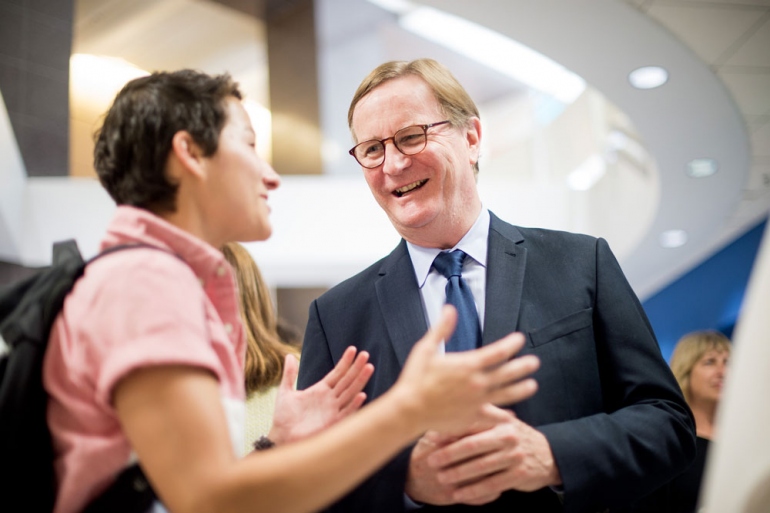 Chancellor Sam Hawgood mingles during a reception after the 2015 State of the University Address