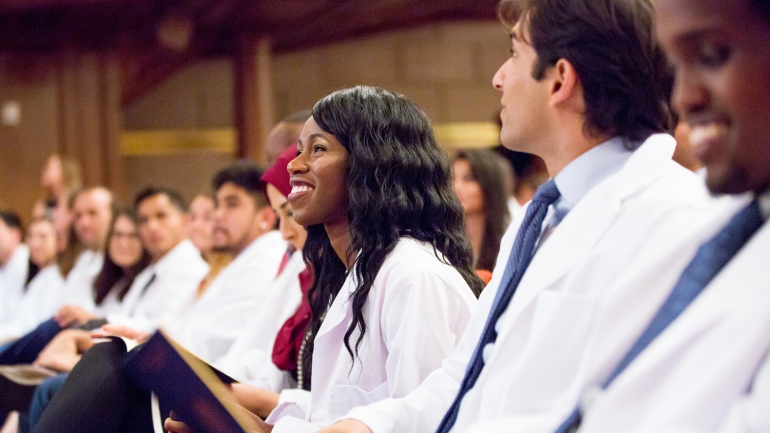 UCSF School of Medicine students smile during their white coat ceremony