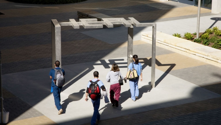 Students walking through the courtyard of the Mission Bay apartments. Photo by Susan Merrell